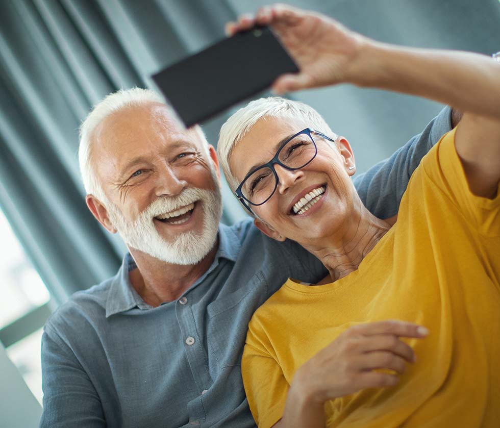 Couple smiling taking a selfie