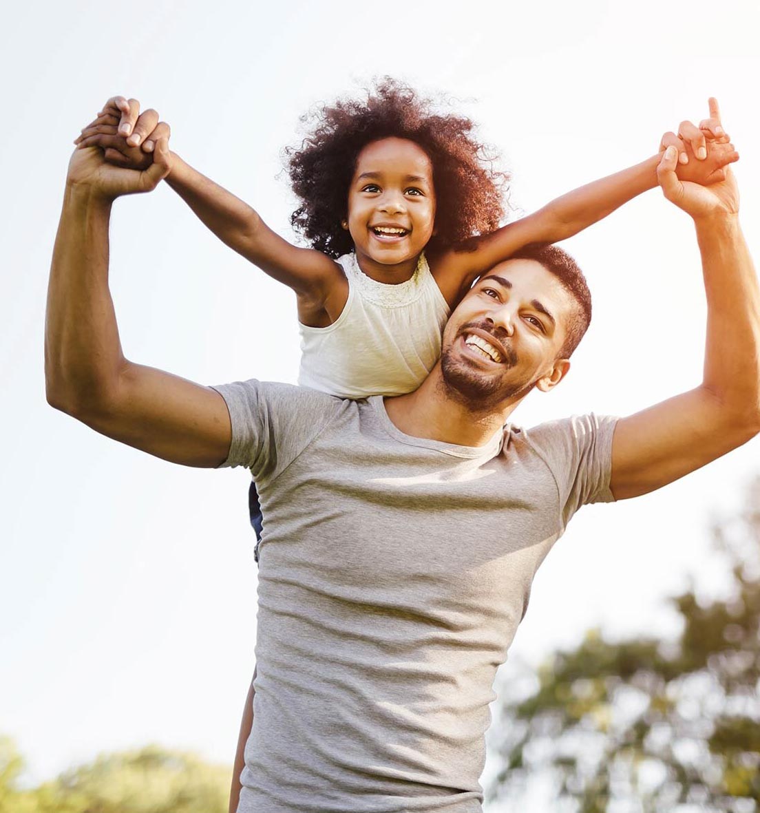 Father giving daughter a piggyback ride